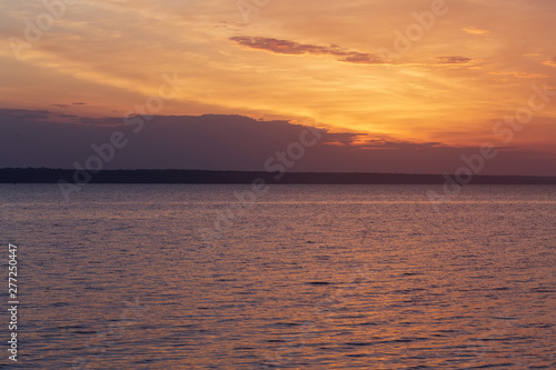 early morning sunrise on a choppy river   wind early spring landscape