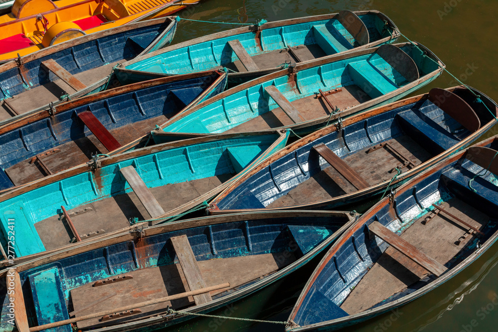 Top view of colorful, wooden flat-bottomed boats, moored on the water. Top view of colorful, wooden flat-bottomed boats, moored on the water.