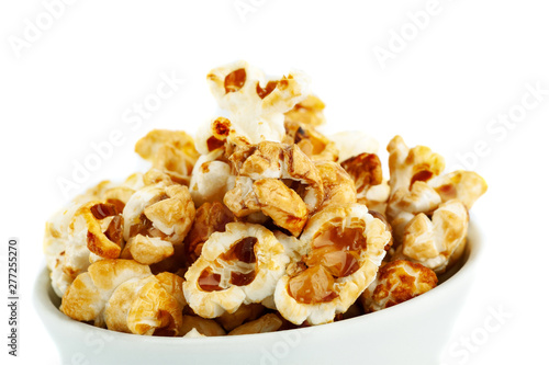 Sweet popcorn in ceramic bowl on white background