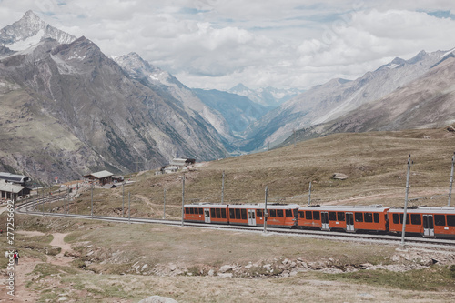 Gornergrat train with tourist is going to Matterhorn mountain