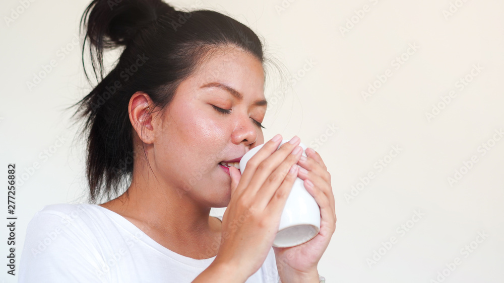 closeup young woman holding mug of hot drink at home with aroma scent , lifestyle concept closeup young woman holding mug of hot drink at home with aroma scent , lifestyle concept