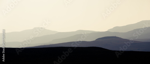 Isle of Skye - misty island landscape - hills silhouette covered in mist