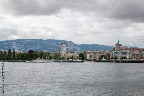 View on Geneva lake  far away mountains and city Geneva  Switzerland