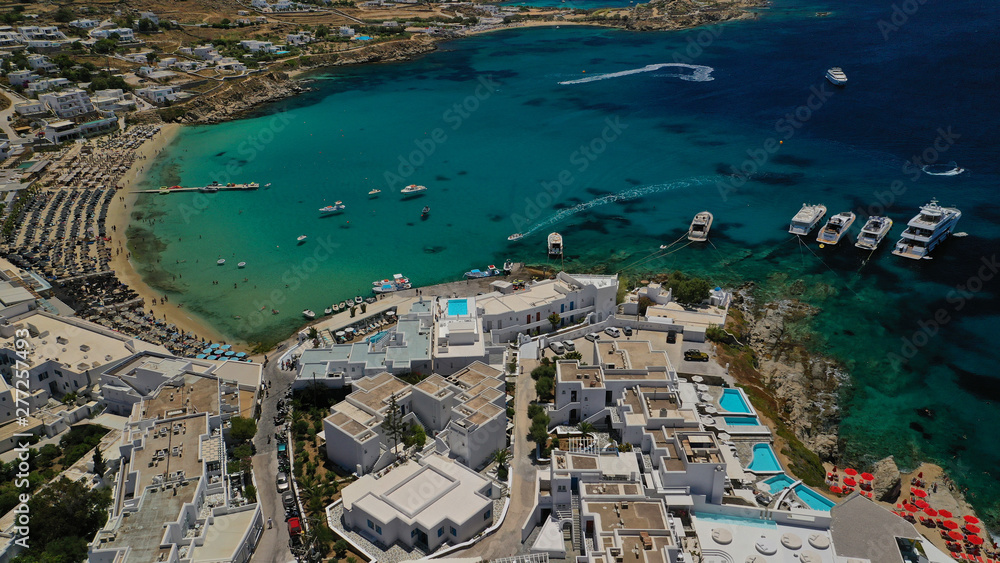 Aerial drone, bird's eye view photo of famous beach of Platy Gialos, Mykonos island, Cyclades, Greece