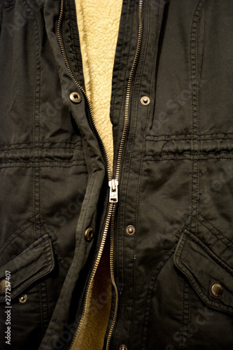 Broken Zipper Up Close Photograph with Both Sides of Zipper Disconnected on a Warm Winter Jacket
