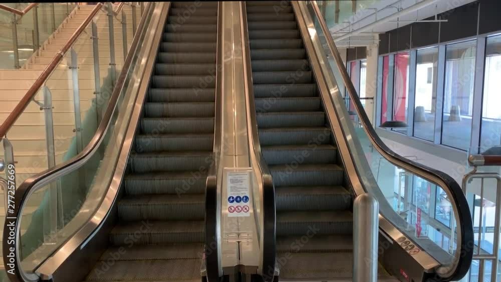 Close-up shot of empty moving staircase. Modern escalator stairs, which moves indoor. Close-up shot of empty moving staircase. Modern escalator stairs, which moves indoor.