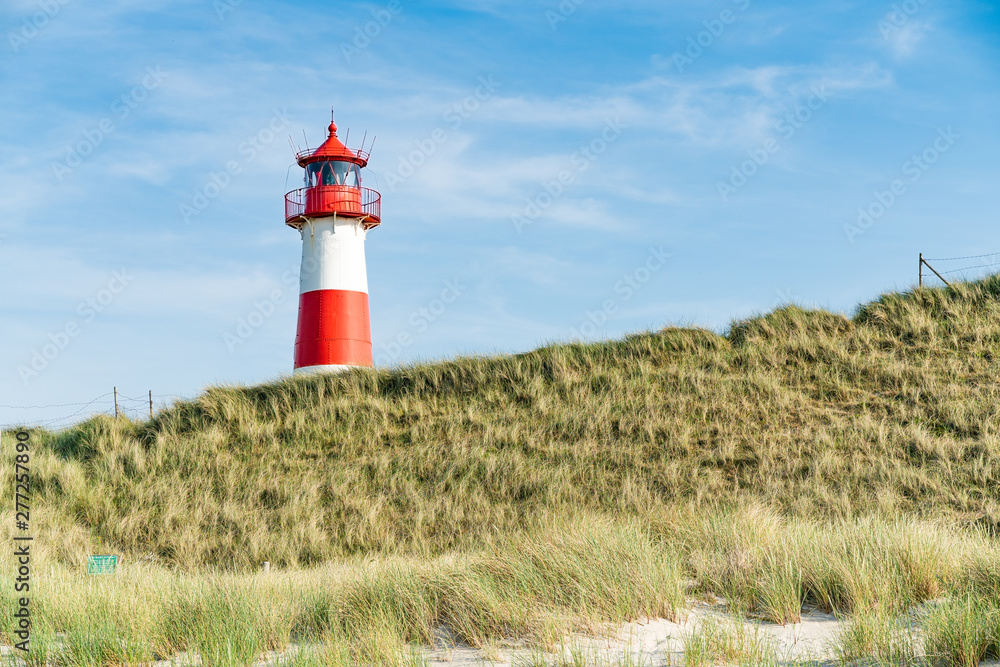 Lighthouse red white on dune. Sylt island – North Germany. Lighthouse red white on dune. Sylt island – North Germany.
