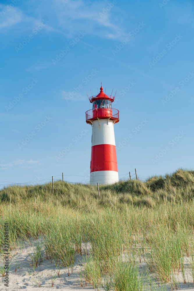 Lighthouse red white on dune. Sylt island – North Germany. Lighthouse red white on dune. Sylt island – North Germany.