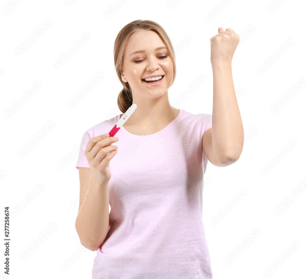 Happy young woman with pregnancy test on white background Happy young woman with pregnancy test on white background