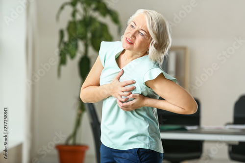 Mature woman suffering from...