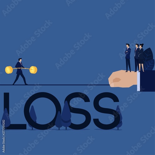 Businessman walk above rope with loss under it metaphor of taking risk.
