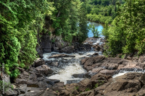 waterfalls and rapids on river Ragged Falls in the forest