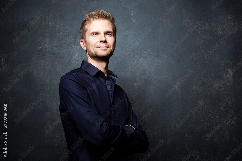 Handsome businessman with hands crossed Handsome businessman with hands crossed