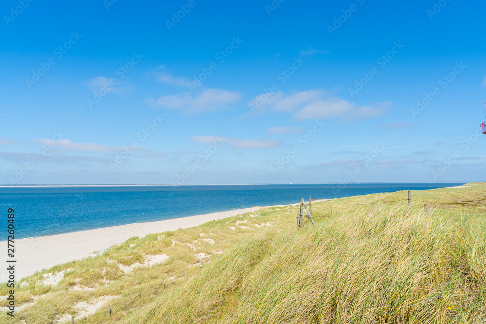 Lighthouse red white on dune. Sylt island – North Germany.  
