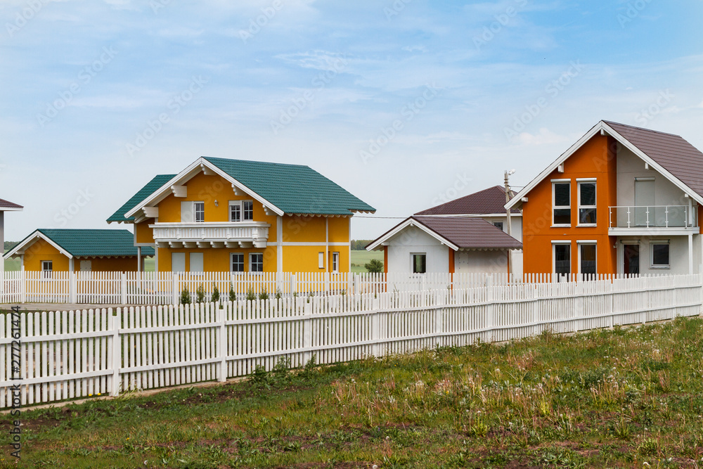modern small colored houses built in the countryside.