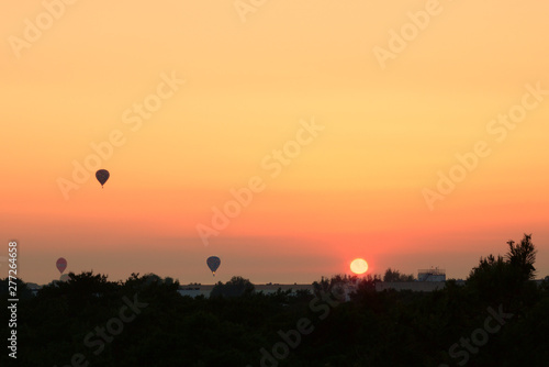 Sunset hot air balloon ride scene. Hot air balloon basket sunset silhouette. Sunset hot air balloon silhouette. Hot air balloon basket sunset silhouette