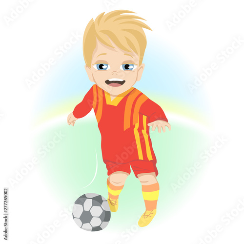 Happy little boy with ball playing football outdoor © Rudzhan
