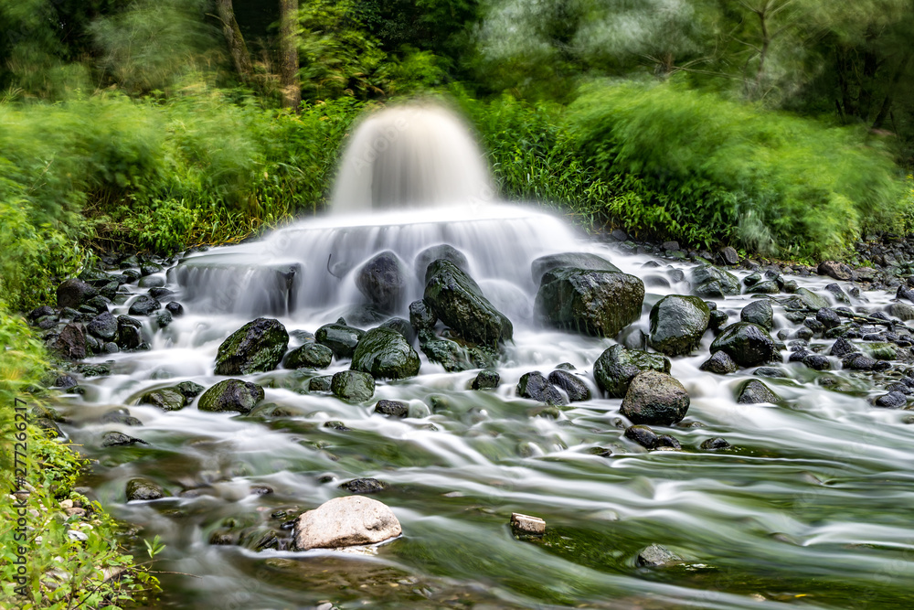 Obraz premium mixing zone of sewage discharge of urban sewage. river pollution. city dumps. long exposure