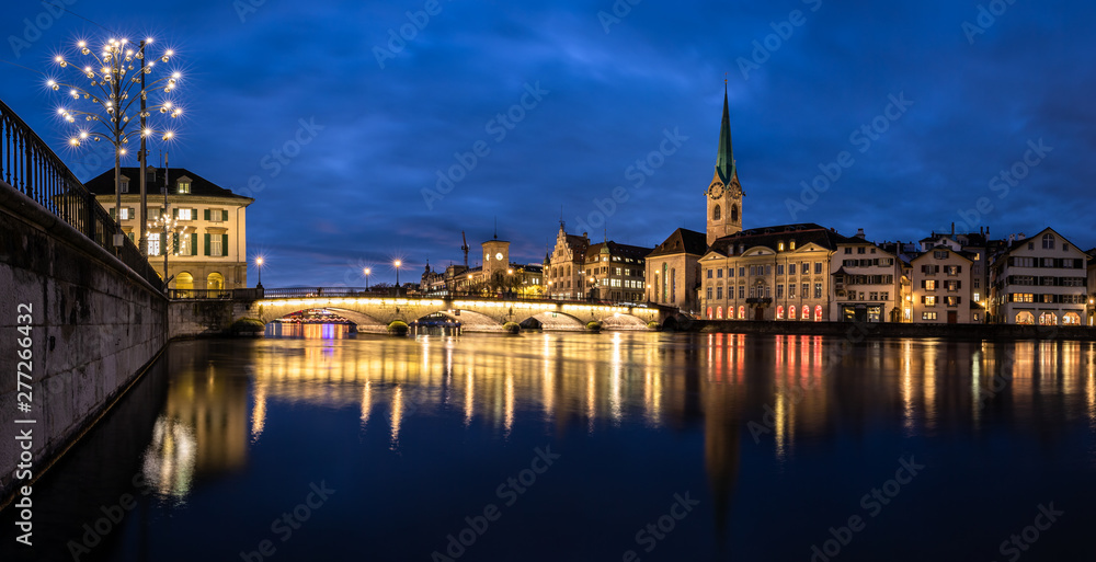 Naklejka premium Zurich, Switzerland - view of the old town with the Limmat river and the Fraumunster church - panoramic image of very high resolution