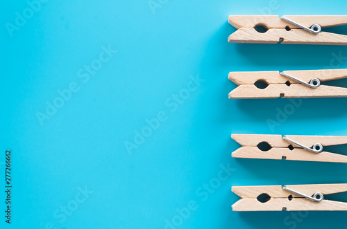 wooden clothespins on blue background