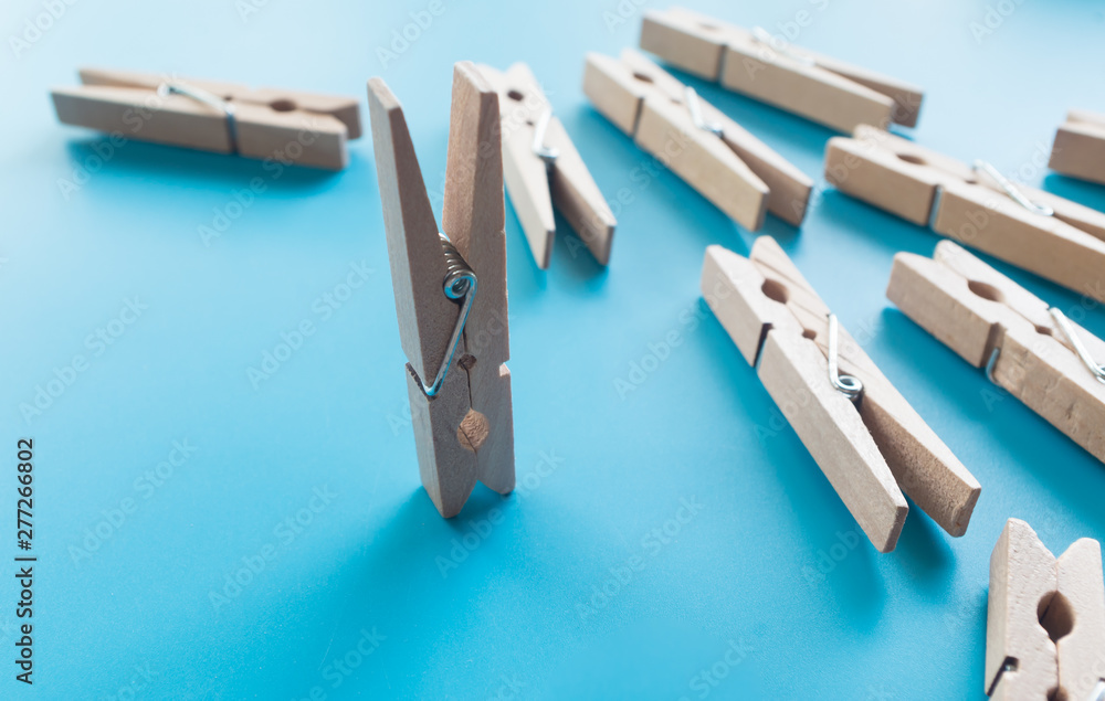 wooden clothespins on blue background wooden clothespins on blue background
