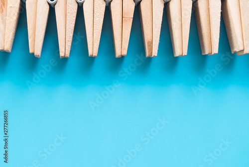 wooden clothespins on blue background