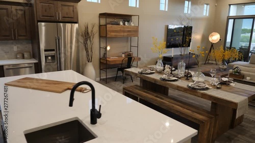 Walk Through Home from Kitchen to Outdoor Patio. view moves through a modern decorated home interior from kitchen through living room and outside to patio area