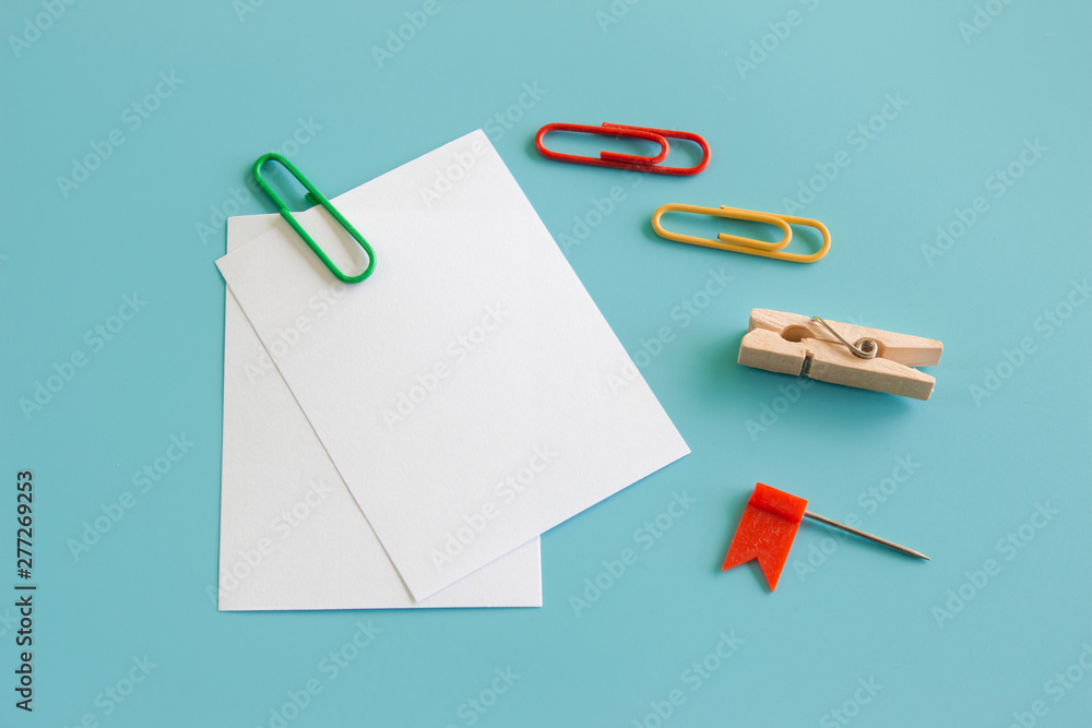 Blank portrait mock-up paper. brochure magazine isolated on blue, changeable background / white paper isolated on light blue paper. Blank portrait mock-up paper. brochure magazine isolated on blue, changeable background / white paper isolated on light blue paper.