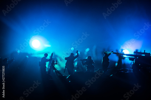 War Concept. Military silhouettes fighting scene on war fog sky background,