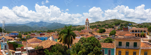 Aerial panoramic view of a small touristic Cuban Town during a sunny and cloudy summer day. Taken in Trinidad, Cuba.