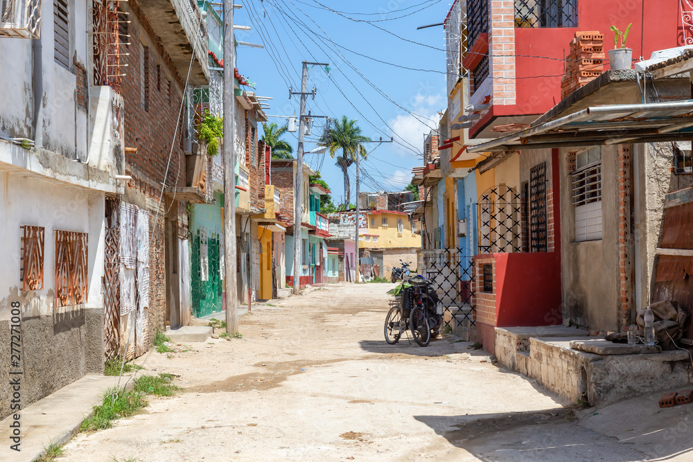 Residential neighborhood in a small Cuban Town during a cloudy and sunny day. Taken in Trinidad, Cuba.