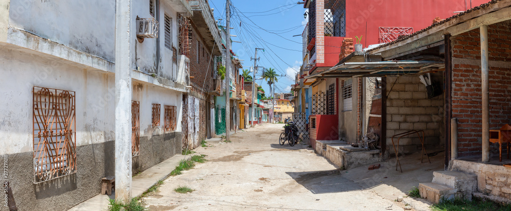Panoramic view of a Residential neighborhood in a small Cuban Town during a cloudy and sunny day. Taken in Trinidad, Cuba. Panoramic view of a Residential neighborhood in a small Cuban Town during a cloudy and sunny day. Taken in Trinidad, Cuba.