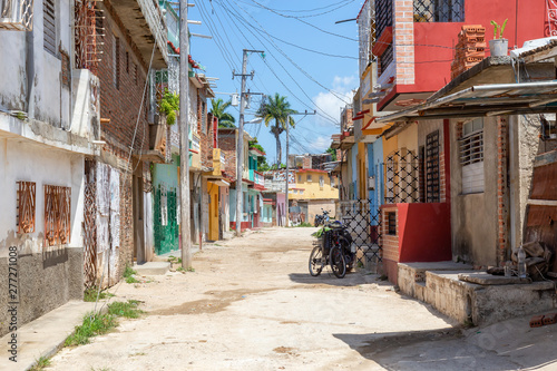 Residential neighborhood in a small Cuban Town during a cloudy and sunny day. Taken in Trinidad, Cuba.