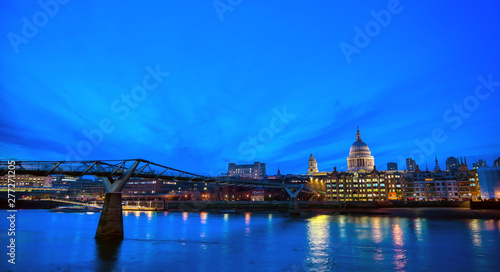 St. Paul's Cathedral across Millennium Bridge and the River Thames in London, UK.