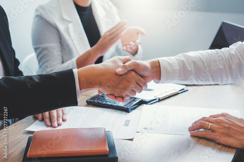 Business Shaking hands greeting new colleagues after during job interview Concept