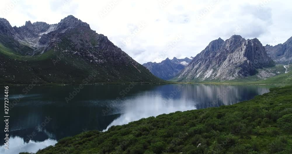 Drone flying over high altitude lake .4k Drone flying over high altitude lake .4k