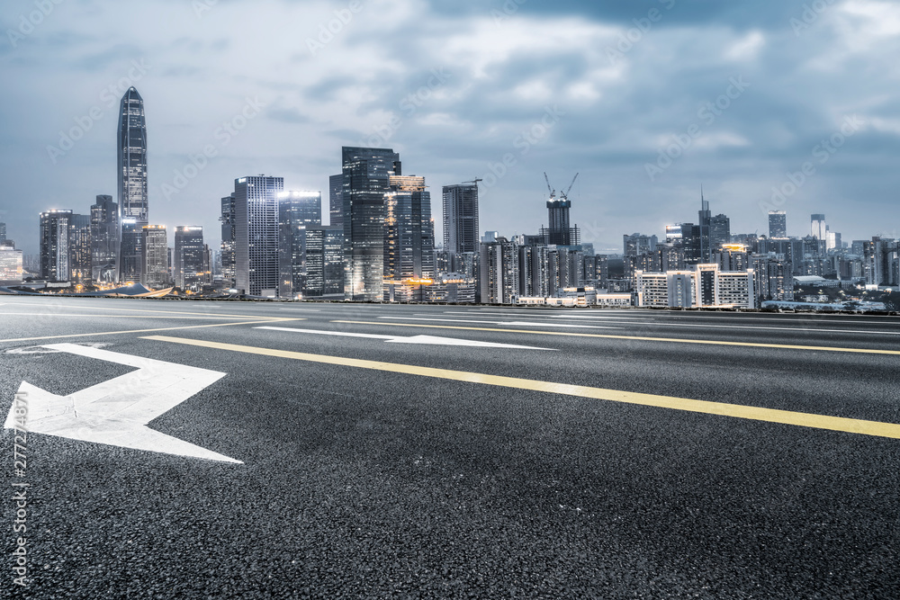 Road Asphalt Pavement and City Architecture Skyline Road Asphalt Pavement and City Architecture Skyline