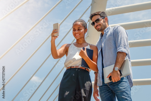 business couple having selfie together outdoor