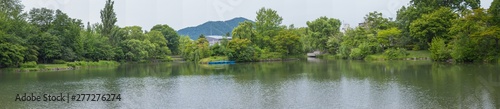 Panorama beautiful landscape view of Lake surrounded with green trees in Nakajima Park (Koen) in Sapporo City, Hokkaido, Japan.