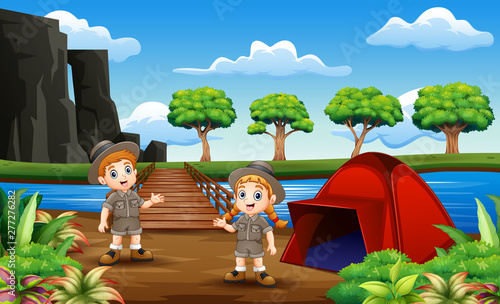 Scout boy and girl camping at nature