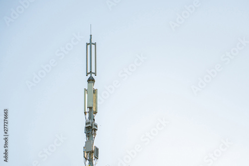 5g modern tv and smartphone telecommunication station antenna against the sky in the city