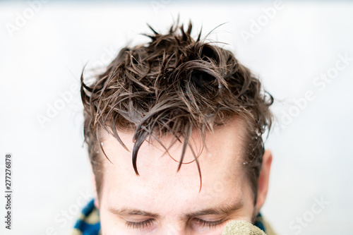wet men hair and holding a towel after taking a shower at home Stock Photo | Adobe Stock wet men hair and holding a towel after taking a shower at home Stock Photo | Adobe Stock