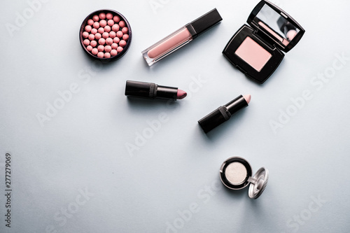 Beauty background makeup cosmetic product on purple spring background. woman mother day concept. flatlay topview