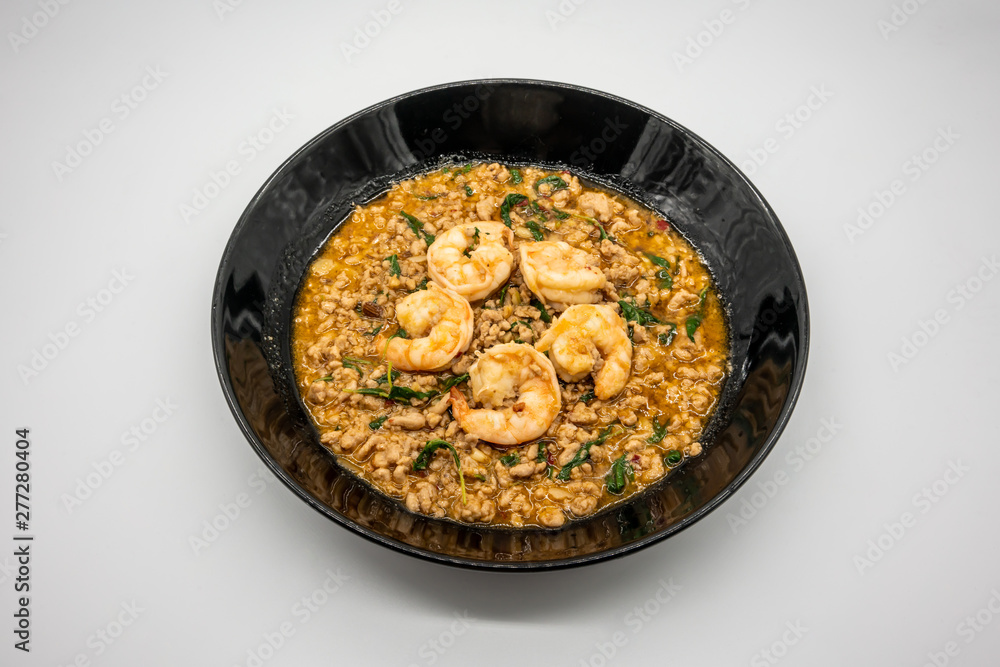 Fry pork and shrimp with basil in black ceramic dish. Pad Ka prao (Stir Fried Pork with Holy Basil). Fry pork and shrimp with basil in black ceramic dish. Pad Ka prao (Stir Fried Pork with Holy Basil).