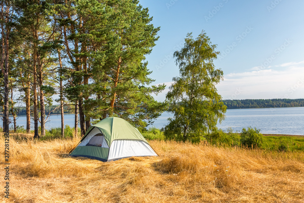 The Camping Tent near the forest lake in Karelia - obrazy, fototapety, plakaty 
