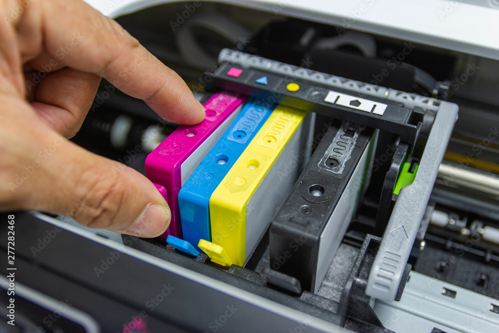 Technicians are installing the color printer inkjet cartridge Technicians are installing the color printer inkjet cartridge