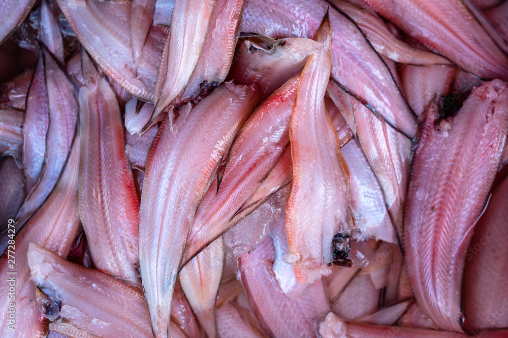 Red fish fillet at street market in Thailand. Seafood concept. Raw sea fish fillet for cooking, closeup Red fish fillet at street market in Thailand. Seafood concept. Raw sea fish fillet for cooking, closeup
