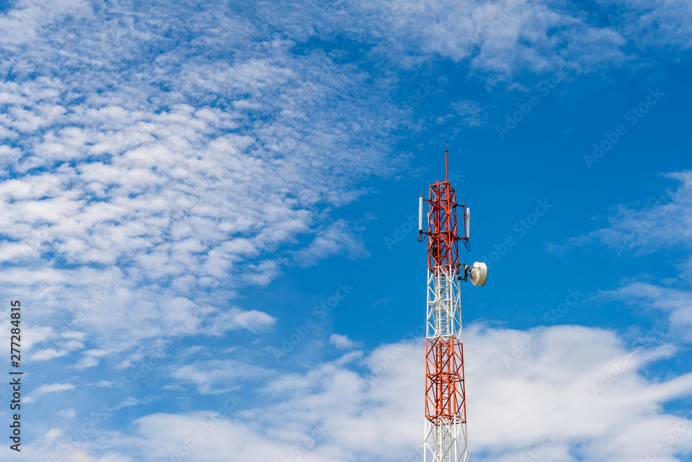 Fototapeta premium Telecom tower pole with blue sky and white cloud background