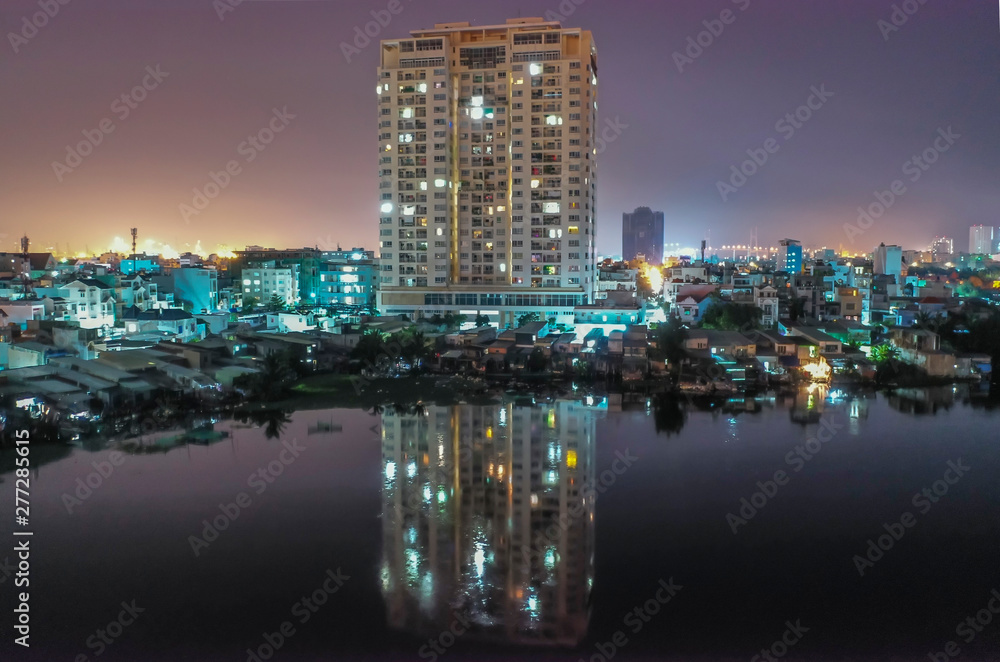 High Rise apartments and reflections,Midnight Drone Flight Photo Suburban Ho Chi Minh City