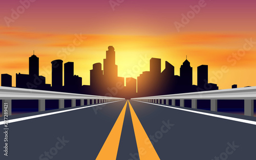 landscape of road to city in sunset